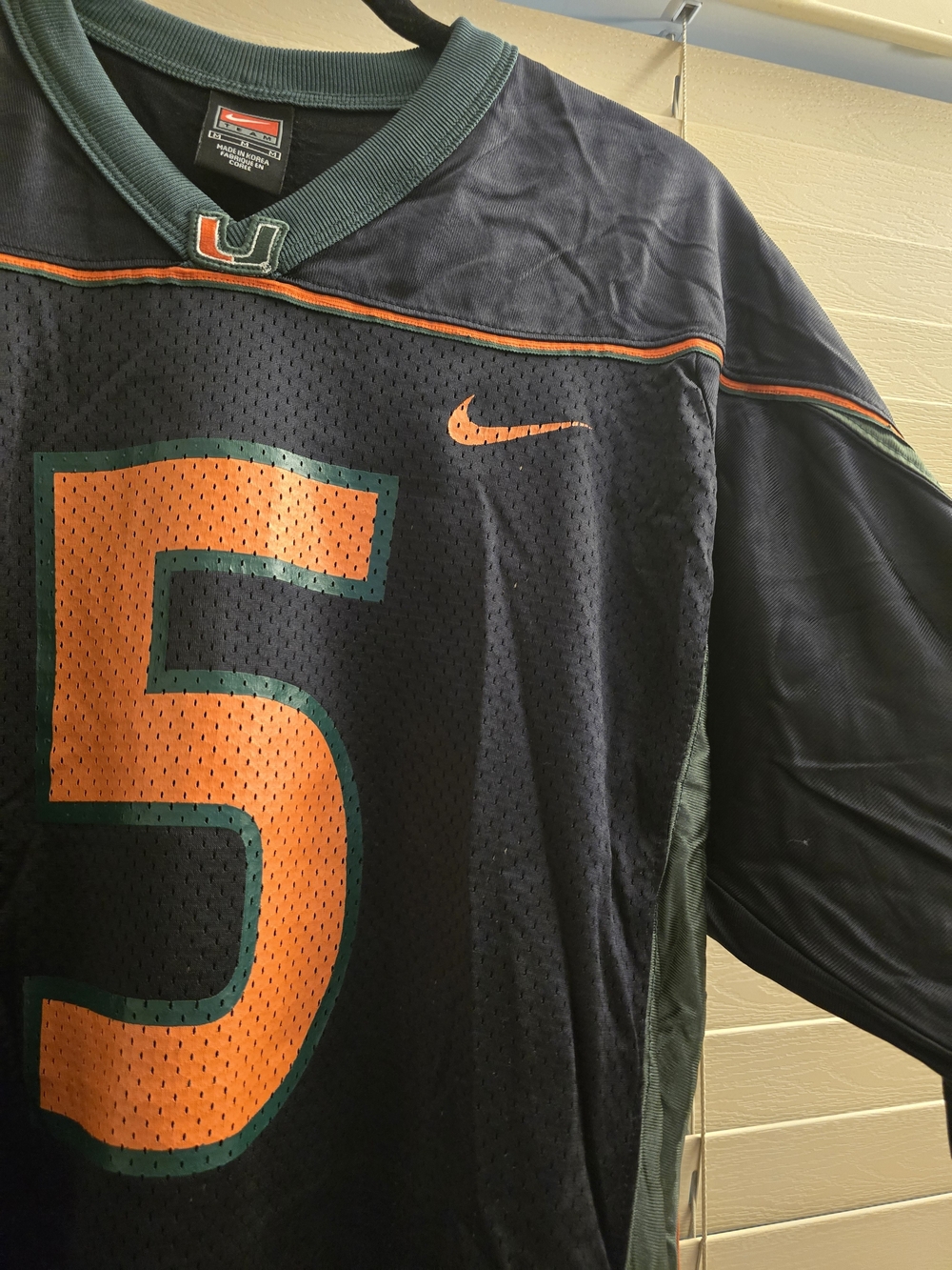Nike UM Black Football Jersey with Orange & Green #5